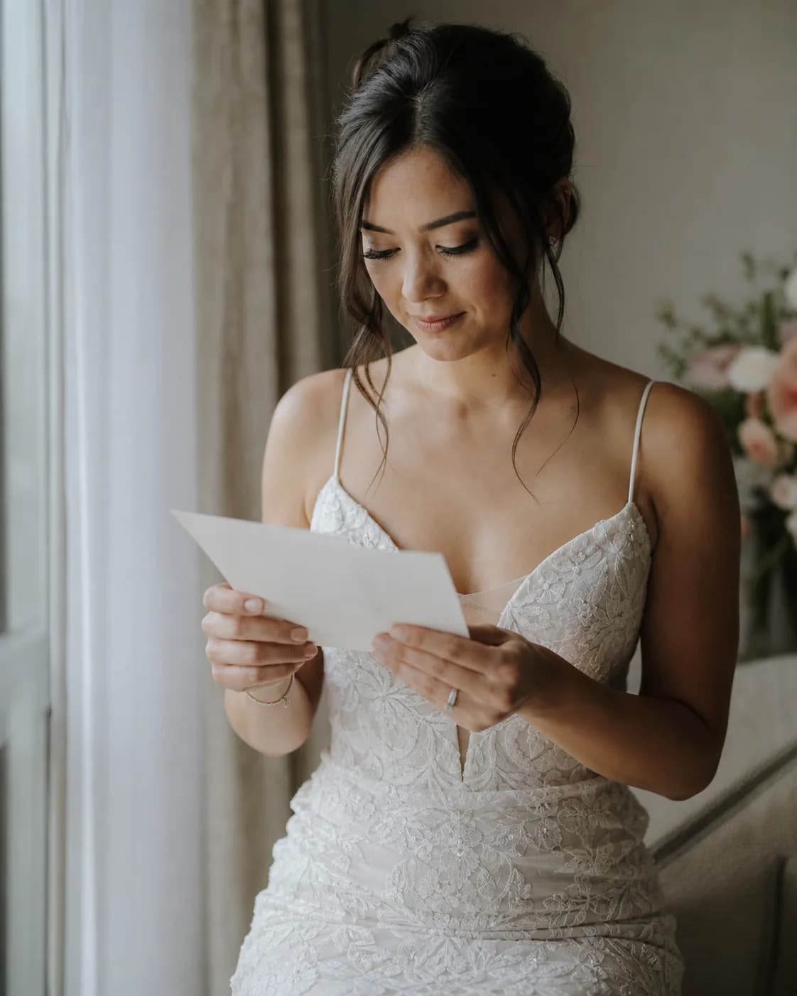 Partner holding vow cards during a quiet pre-ceremony moment